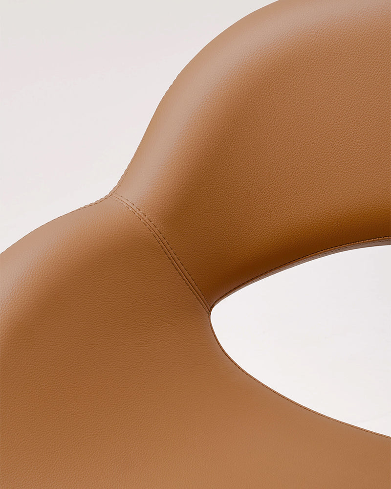 Thea - Cognac-coloured styling chair with black cross base